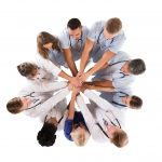 group of medical staff hands together